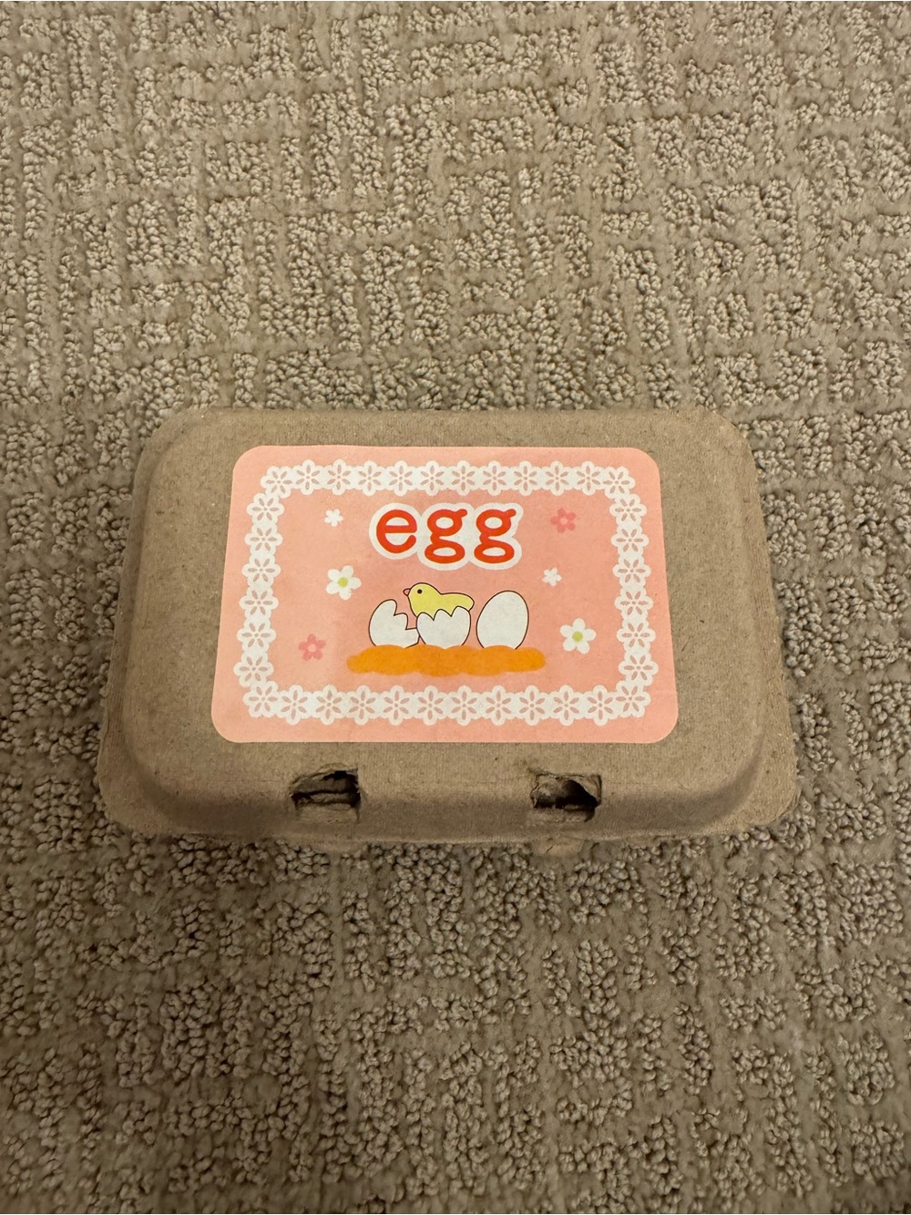 Amazon Beige Egg Carton with Pink Decorative Label